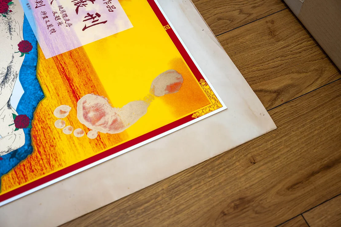 Yokoo personally used his own feet to stamp on each poster, making every piece unique.